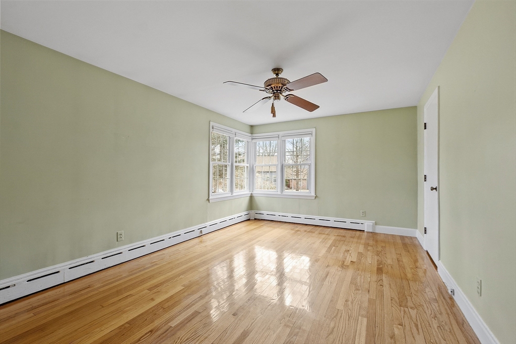 38 Knower Road Westminster, MA 01473 - Photo 13 of 24 a view of an empty room with a window and wooden floor