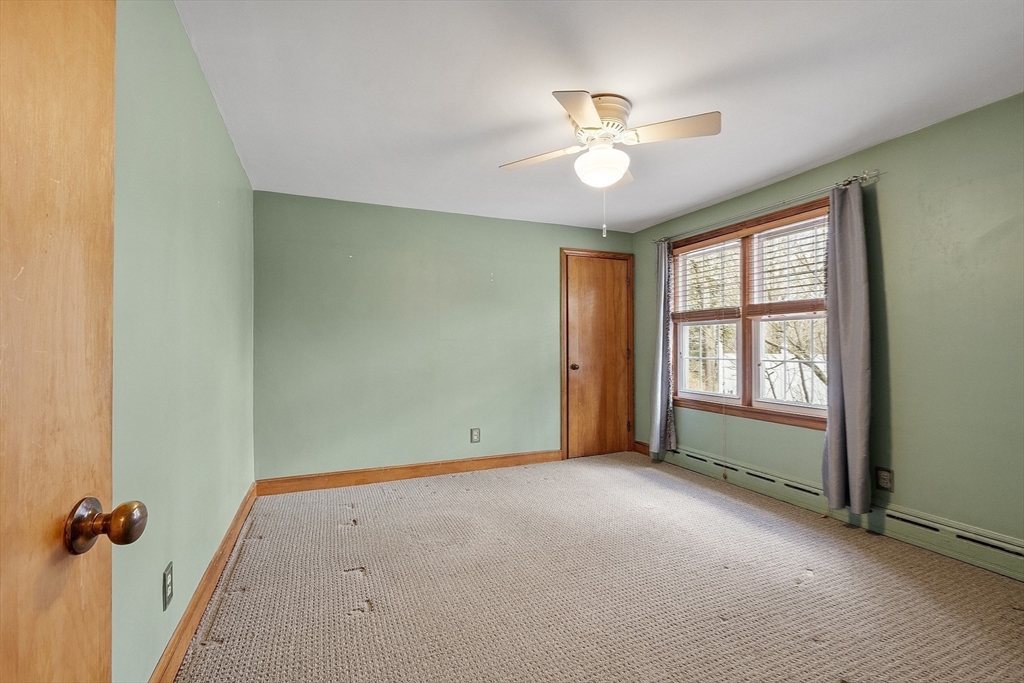 38 Knower Road Westminster, MA 01473 - Photo 14 of 24 an empty room with windows and fan