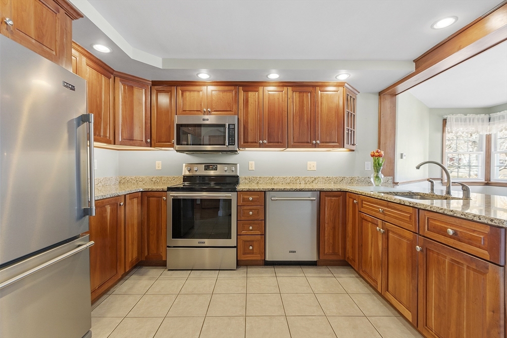 38 Knower Road Westminster, MA 01473 - Photo 2 of 24 a kitchen with stainless steel appliances granite countertop a refrigerator and a stove top oven
