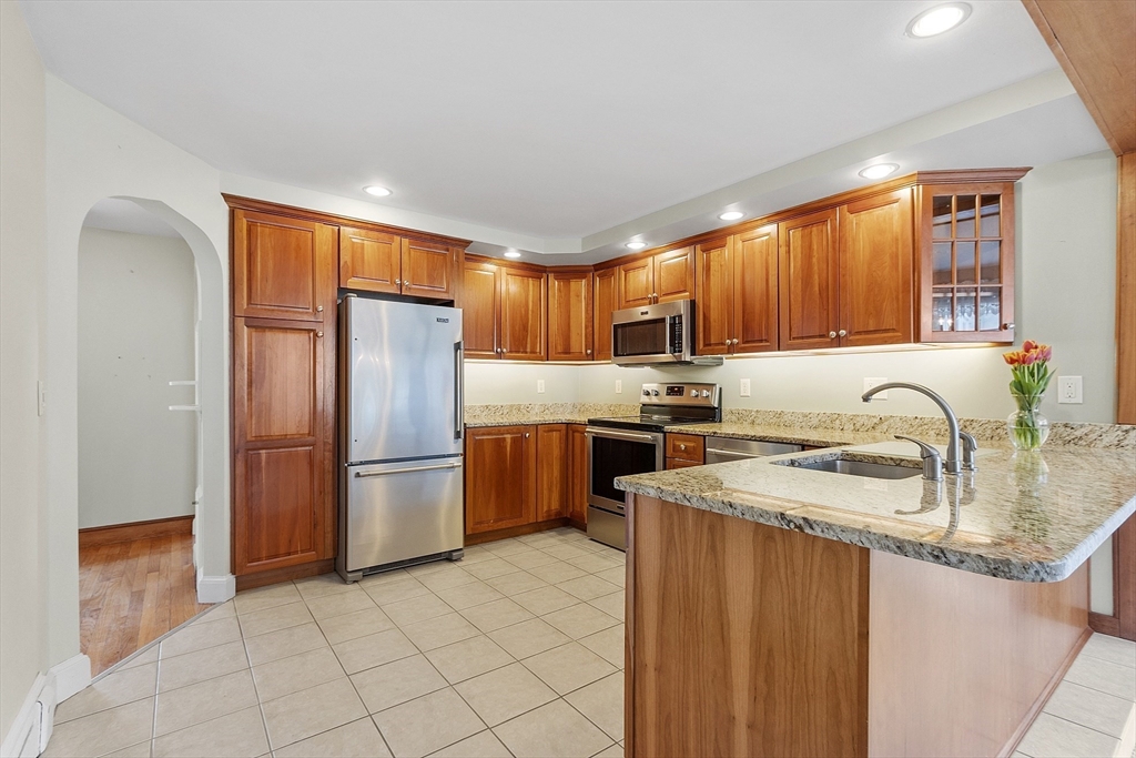 38 Knower Road Westminster, MA 01473 - Photo 3 of 24 a kitchen with a refrigerator sink and wooden cabinets