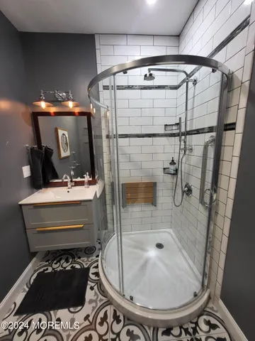 a bathroom with a sink and a mirror