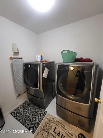 a living room with furniture and a rug