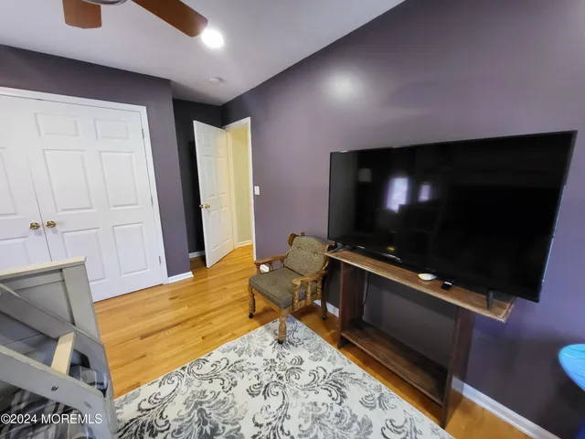 a room with furniture and flat screen tv