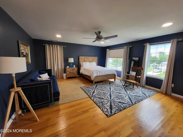 a living room with furniture rug and window