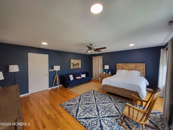 a bed room with a bed and a chandelier
