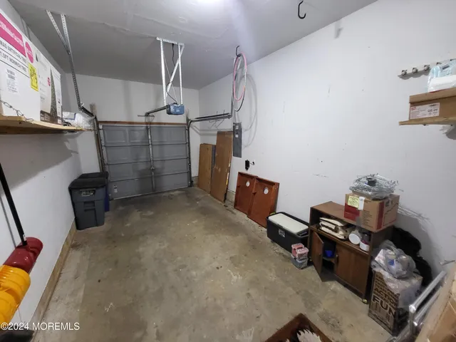 a view of a porch with furniture and floor to ceiling window