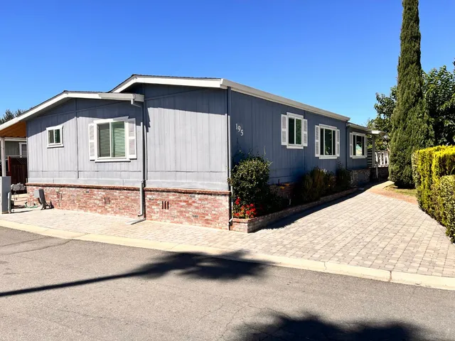 a view of a house with snow on the road