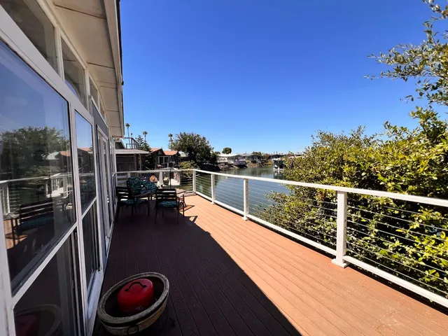 a very nice looking room with wooden floor and furniture