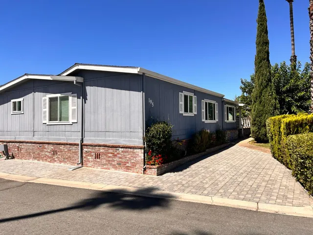 a front view of a house with yard