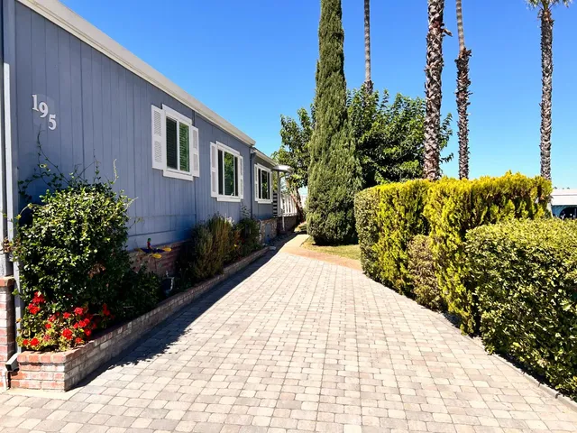a view of a house with a tree