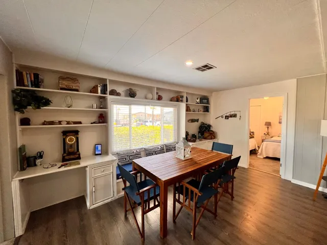 a bedroom with two beds and a window