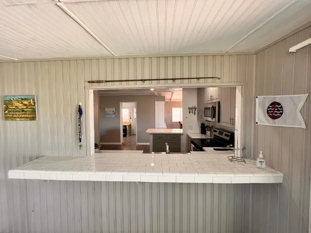 a bedroom with a bed and a chair