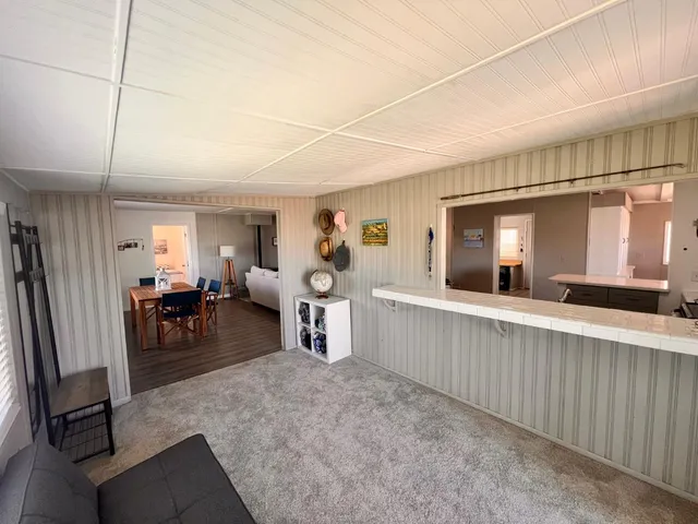 a bedroom with a bed and a television