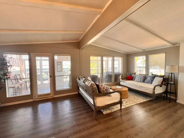 a view of a livingroom with furniture and a potted plant