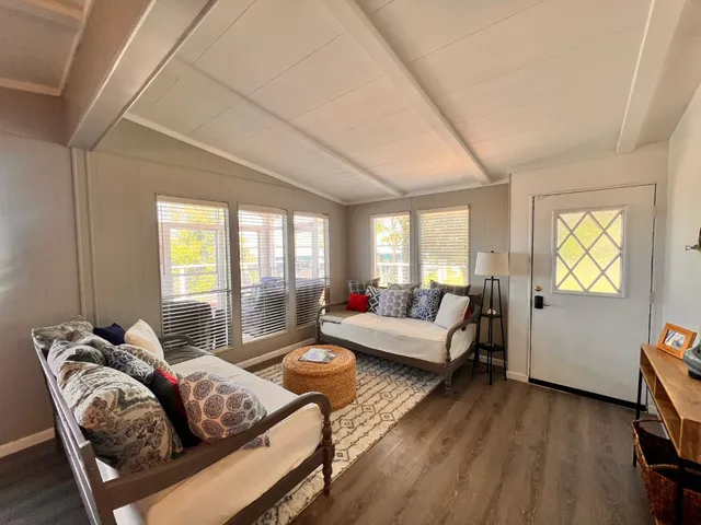 a spacious en suite bathroom with a double vanity sink and a mirror
