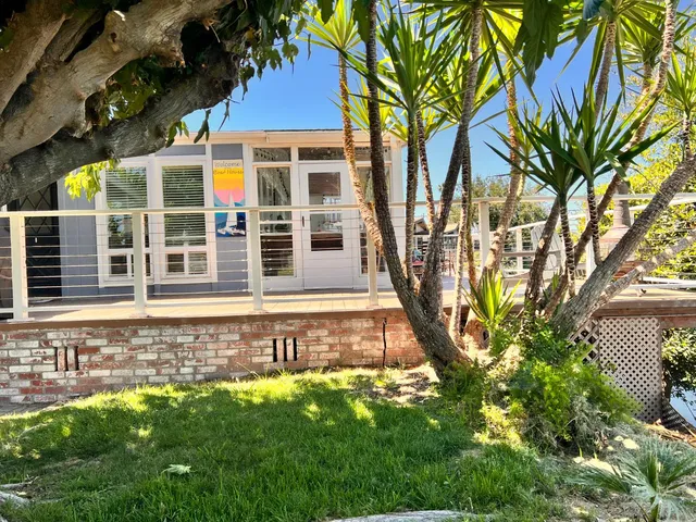a view of a balcony with wooden floor