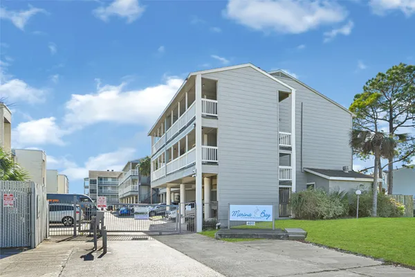 a front view of a building with garden