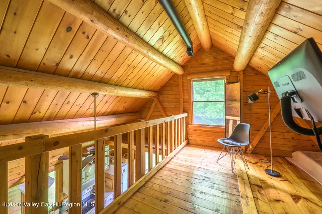 a view of a chairs and table in the balcony