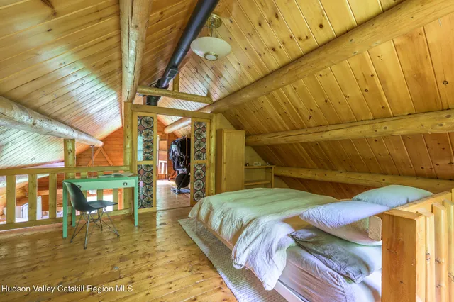 a bed sitting in a bedroom next to a building