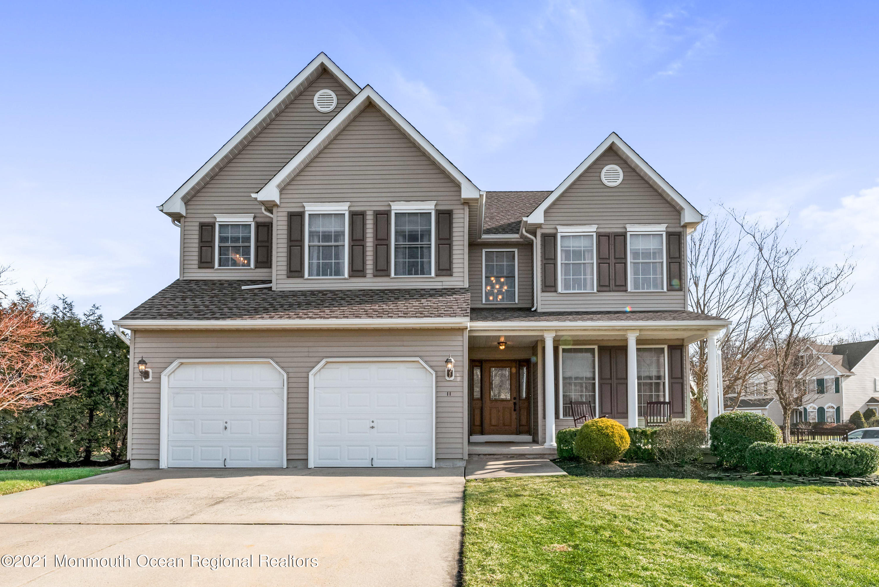 11 Grindstone Road Howell, NJ 07731 - Photo 1 of 45 a front view of a house with garden
