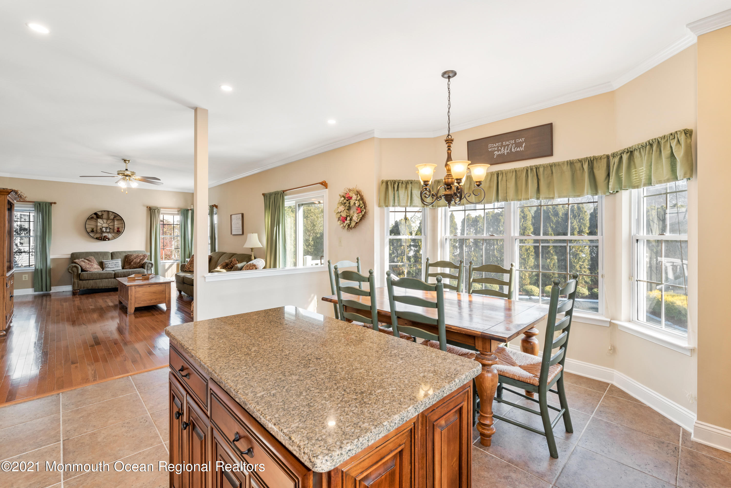 11 Grindstone Road Howell, NJ 07731 - Photo 14 of 45 a dining table chairs and a chandelier