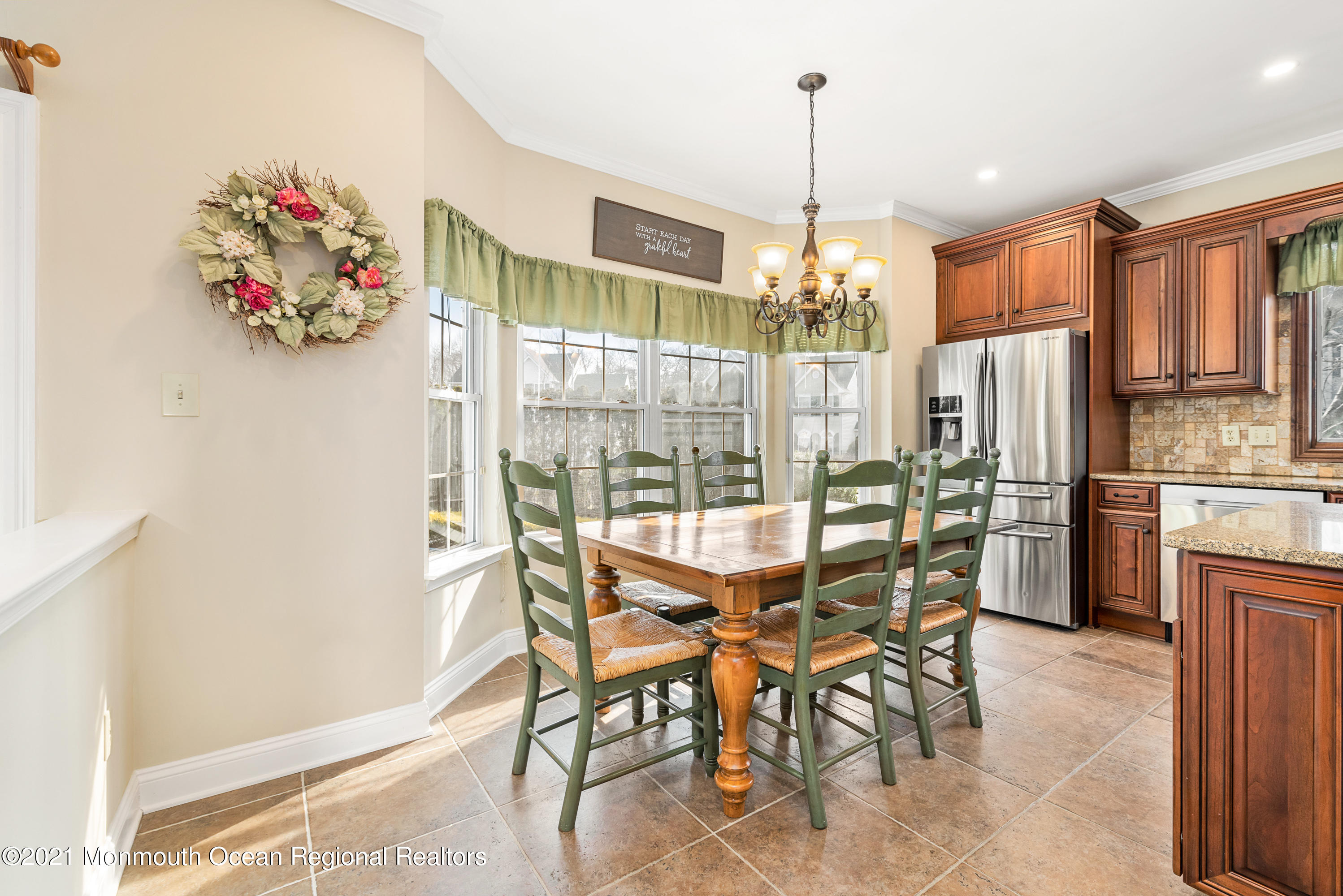 11 Grindstone Road Howell, NJ 07731 - Photo 16 of 45 a view of a dining room with furniture and chandelier