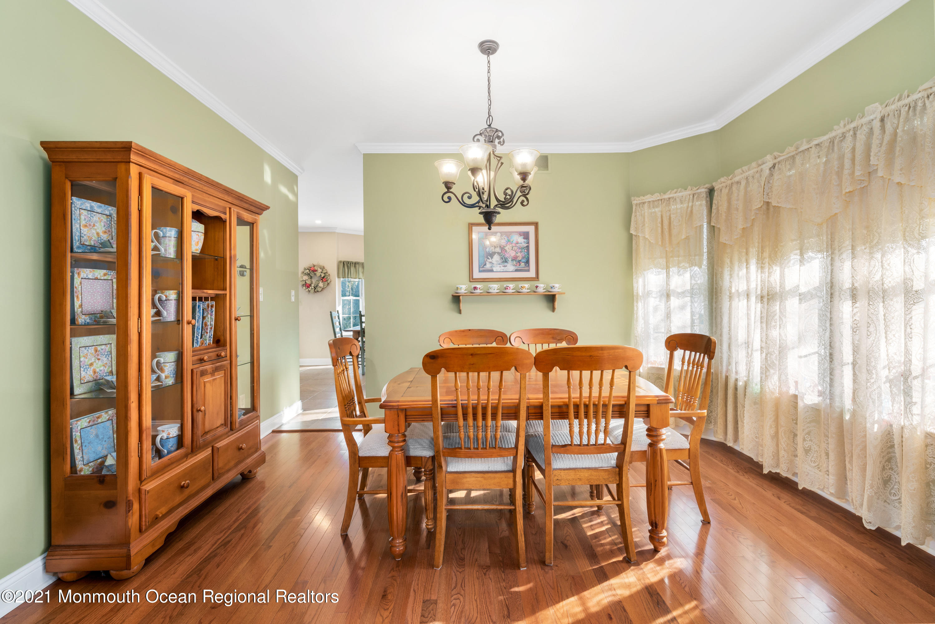 11 Grindstone Road Howell, NJ 07731 - Photo 17 of 45 a view of a dining room with furniture window and wooden floor