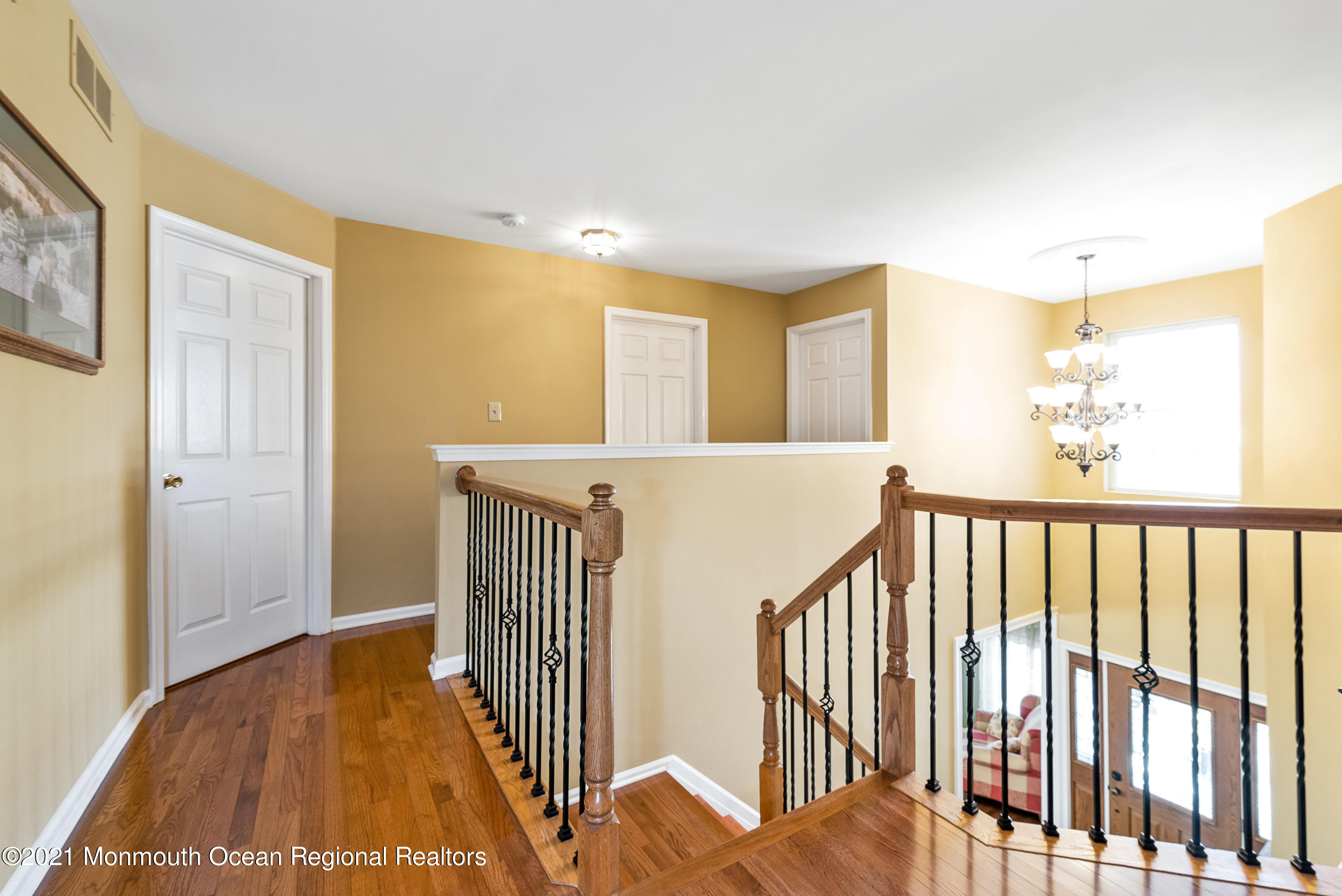 11 Grindstone Road Howell, NJ 07731 - Photo 21 of 45 a view of a hallway with wooden floor and windows