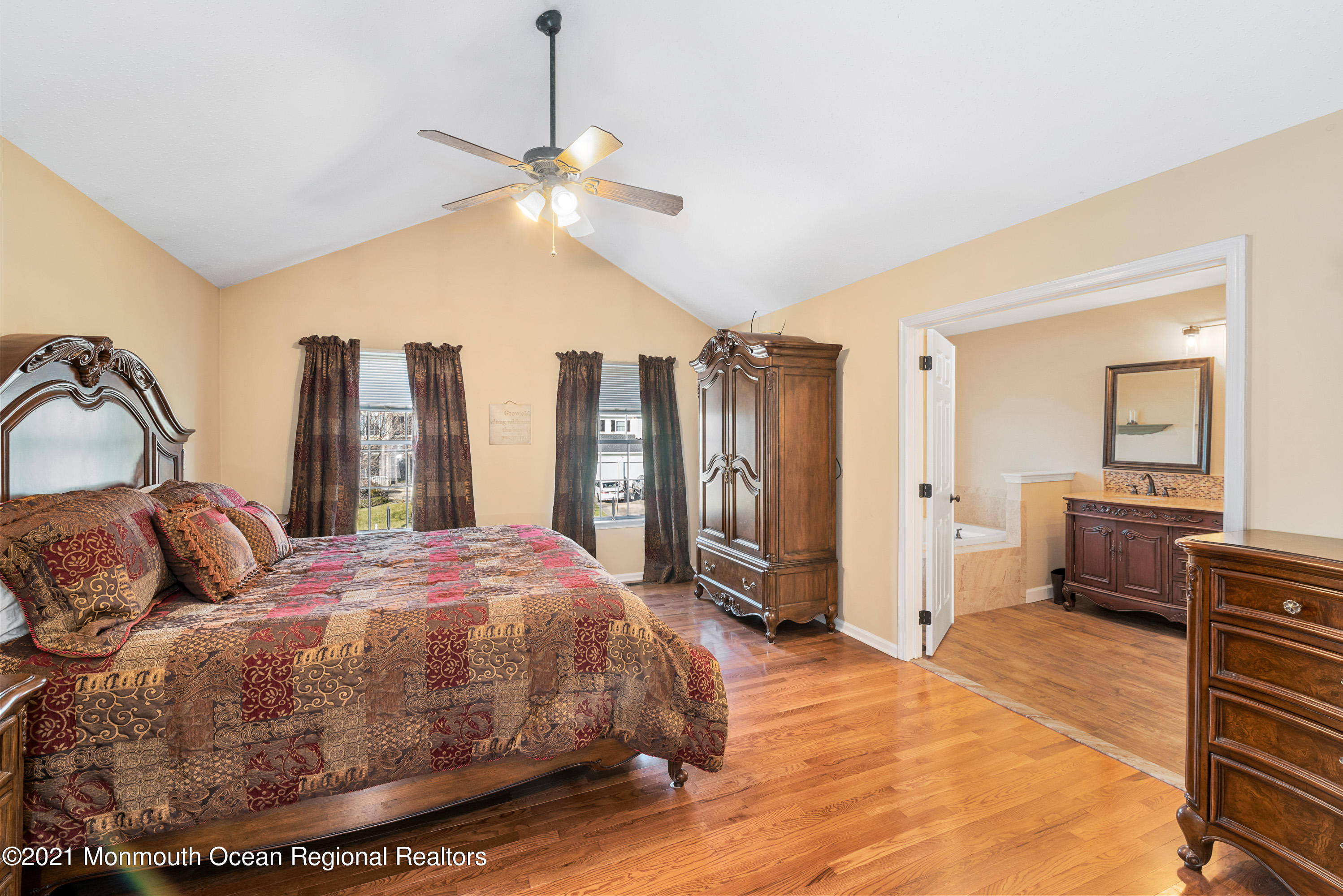 11 Grindstone Road Howell, NJ 07731 - Photo 22 of 45 a bedroom with a bed a dresser and large mirror