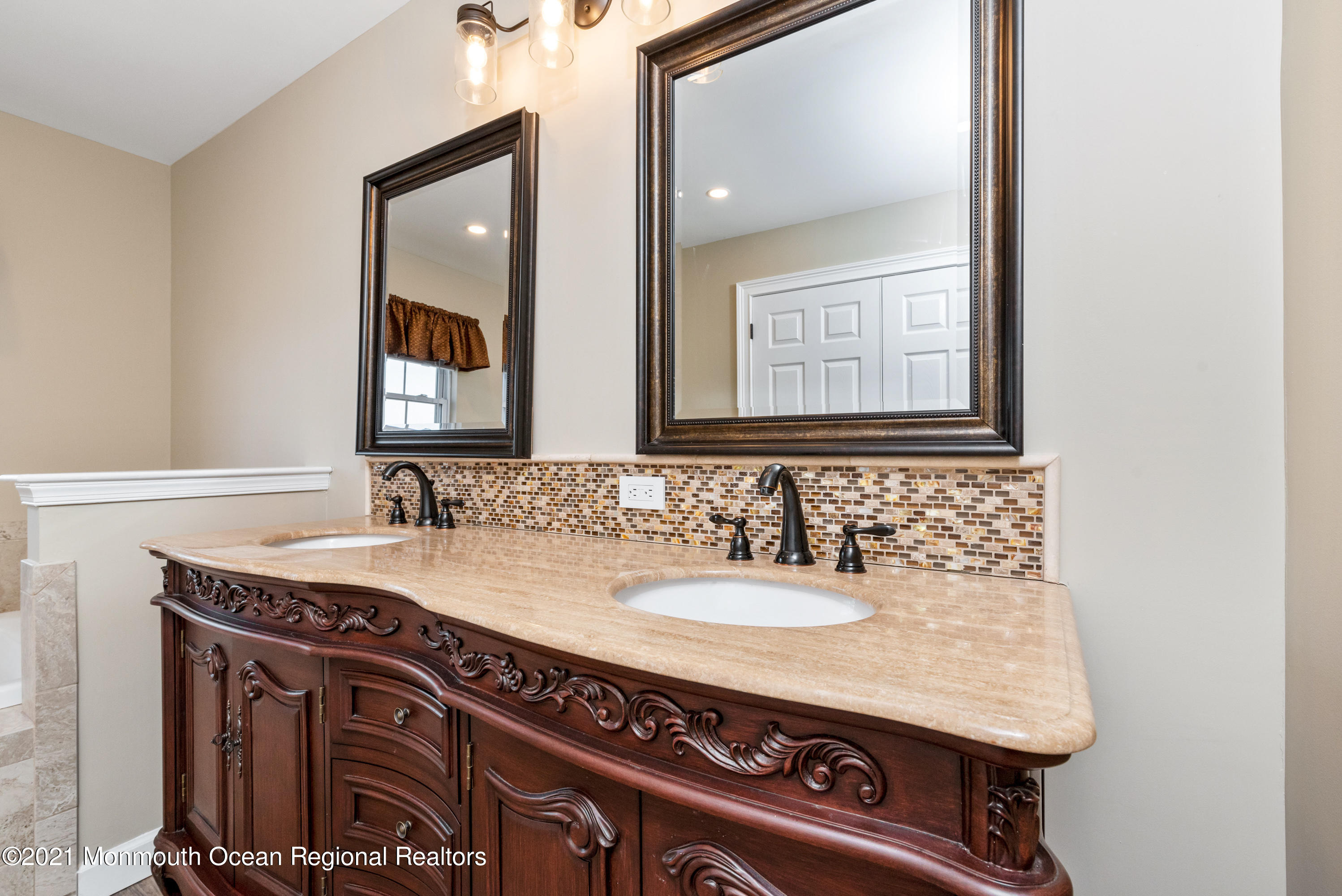 11 Grindstone Road Howell, NJ 07731 - Photo 24 of 45 a bathroom with a sink and a mirror