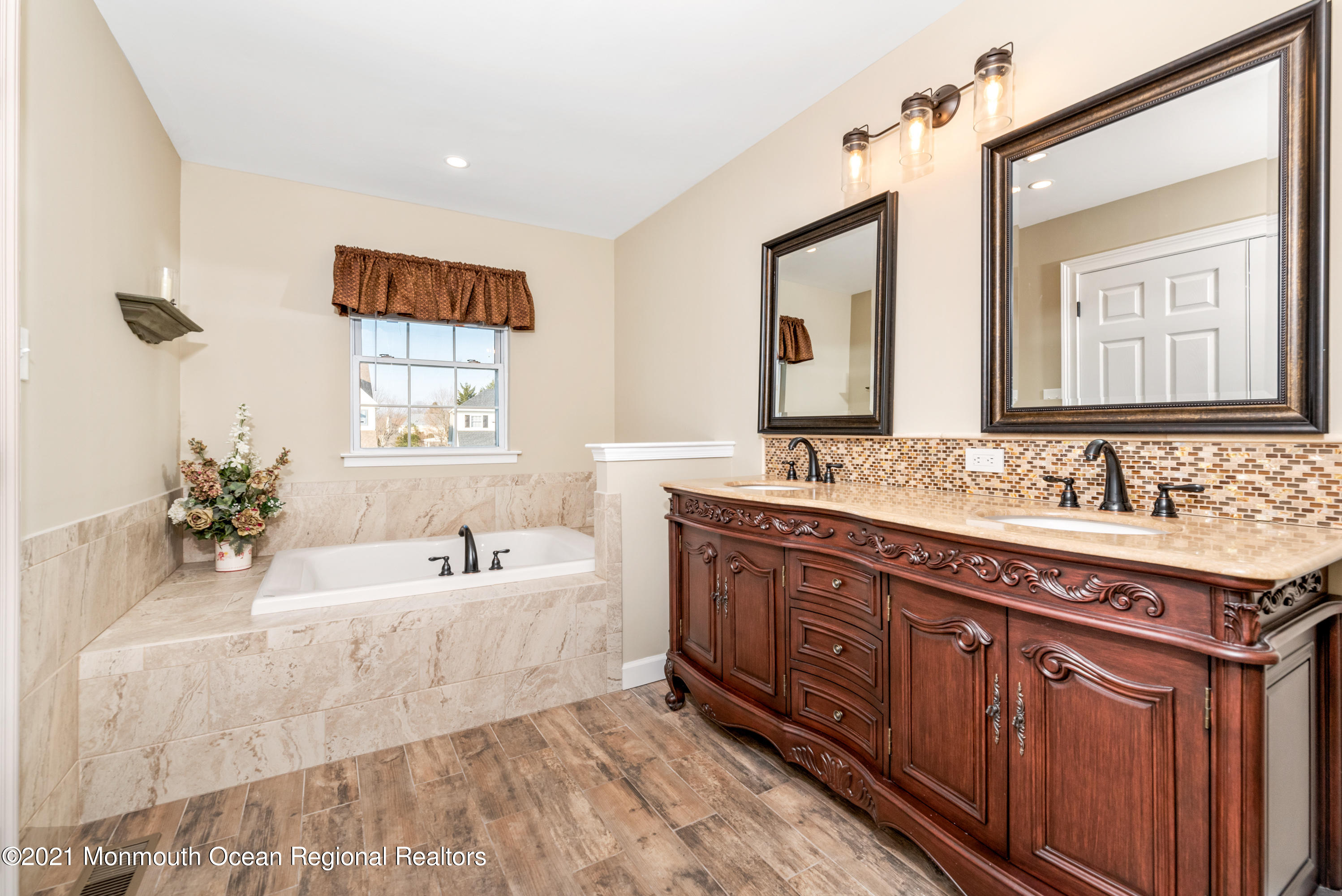 11 Grindstone Road Howell, NJ 07731 - Photo 25 of 45 a spacious bathroom with a tub sink and mirror
