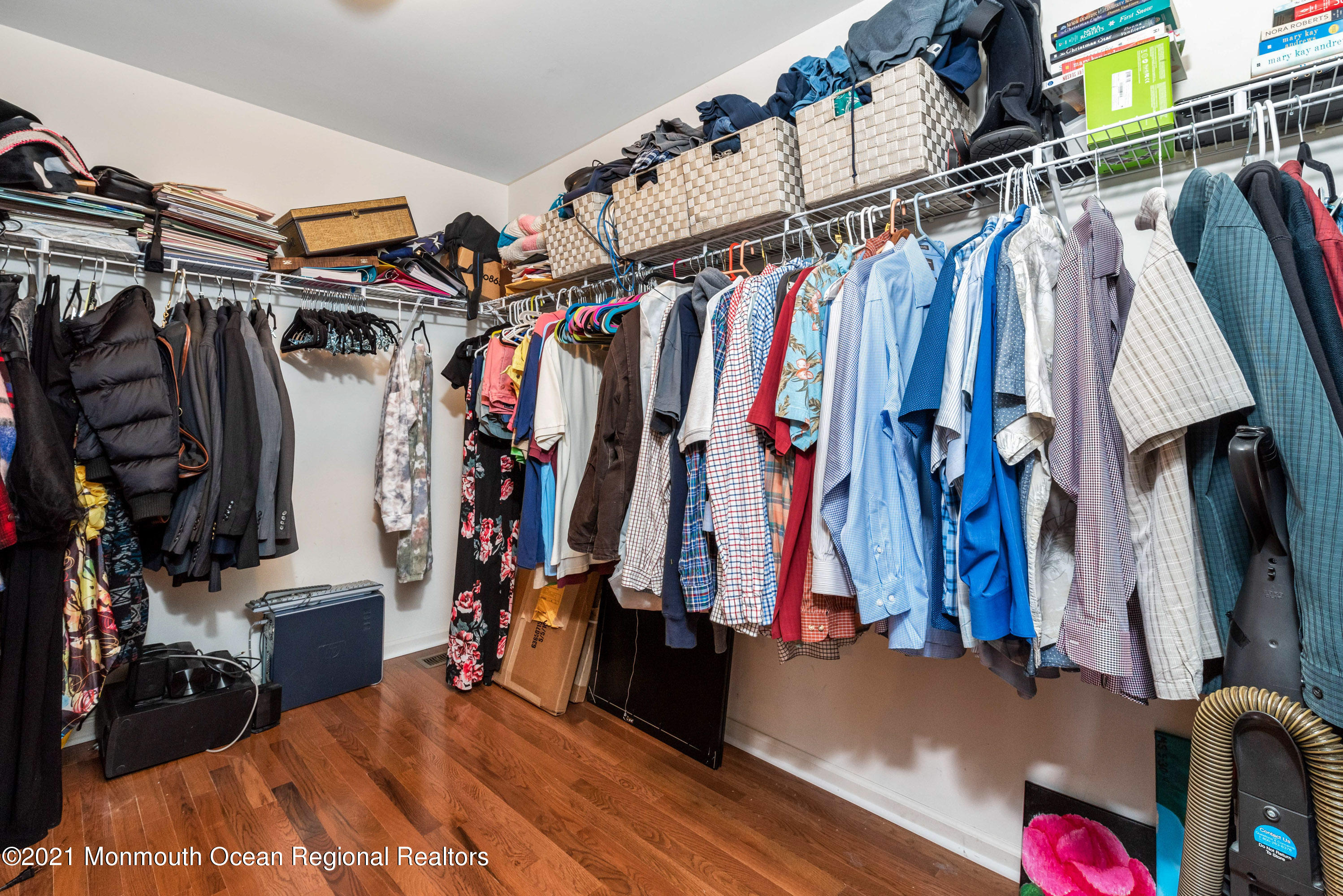 11 Grindstone Road Howell, NJ 07731 - Photo 29 of 45 a view of walk in closet with clothes and shoes