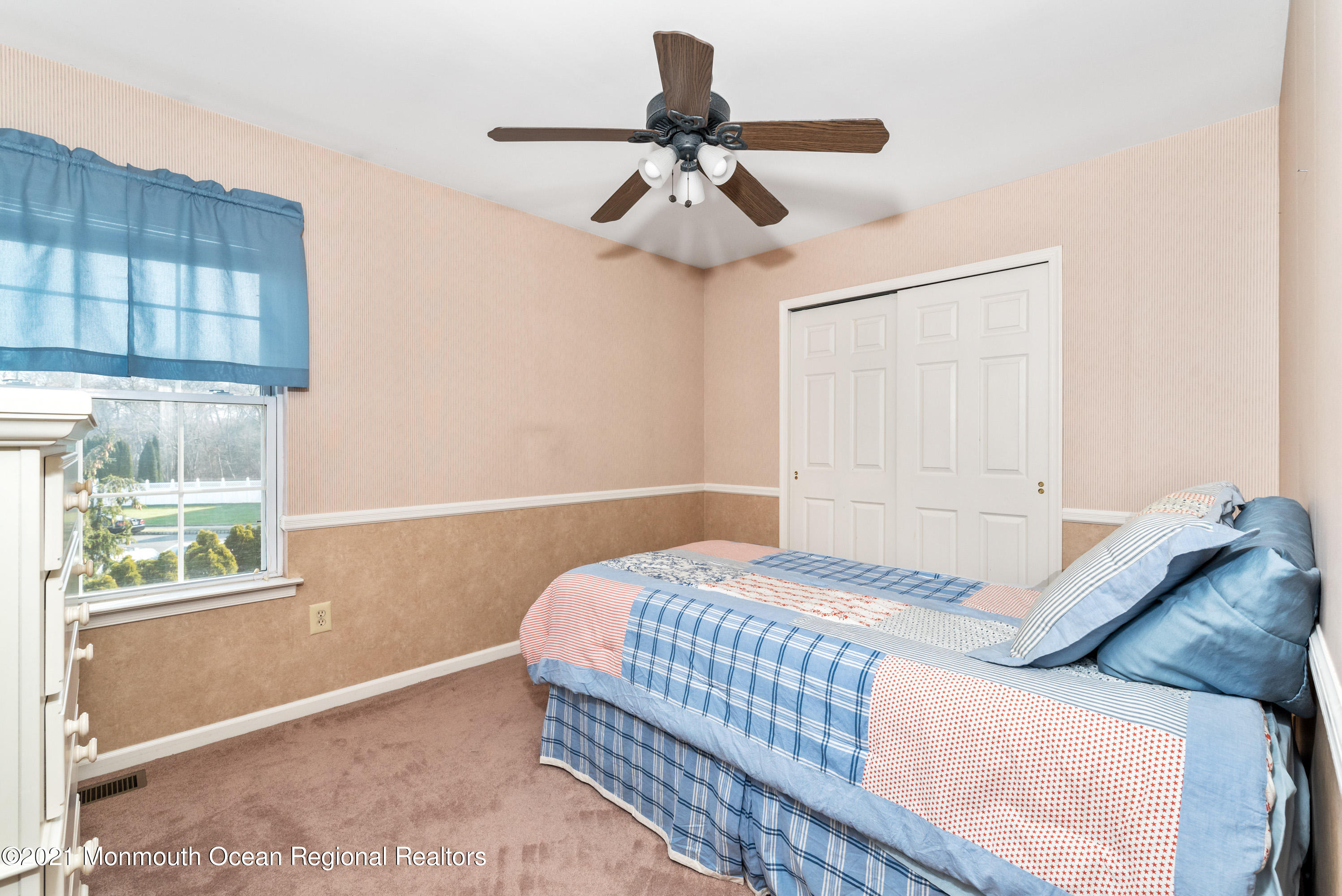 11 Grindstone Road Howell, NJ 07731 - Photo 32 of 45 a bedroom with a bed and a window