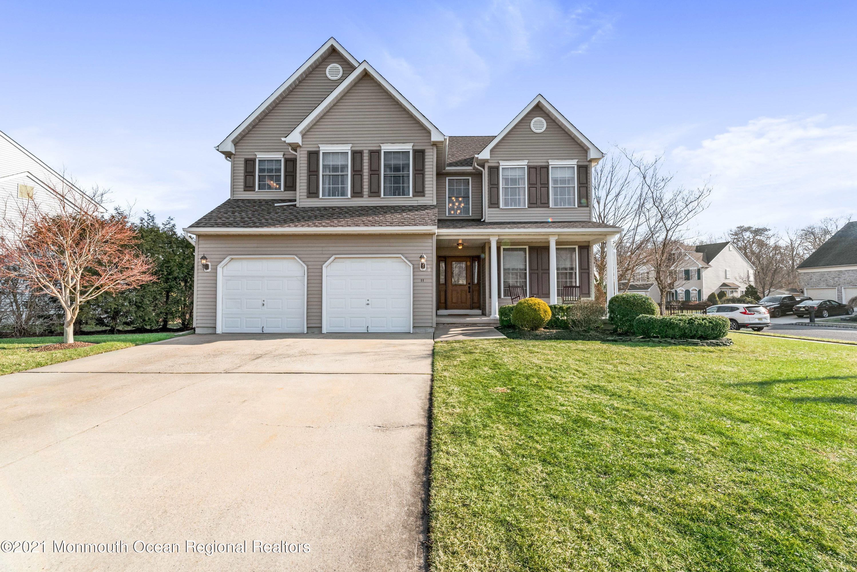 11 Grindstone Road Howell, NJ 07731 - Photo 6 of 45 a front view of a house with a yard and garage