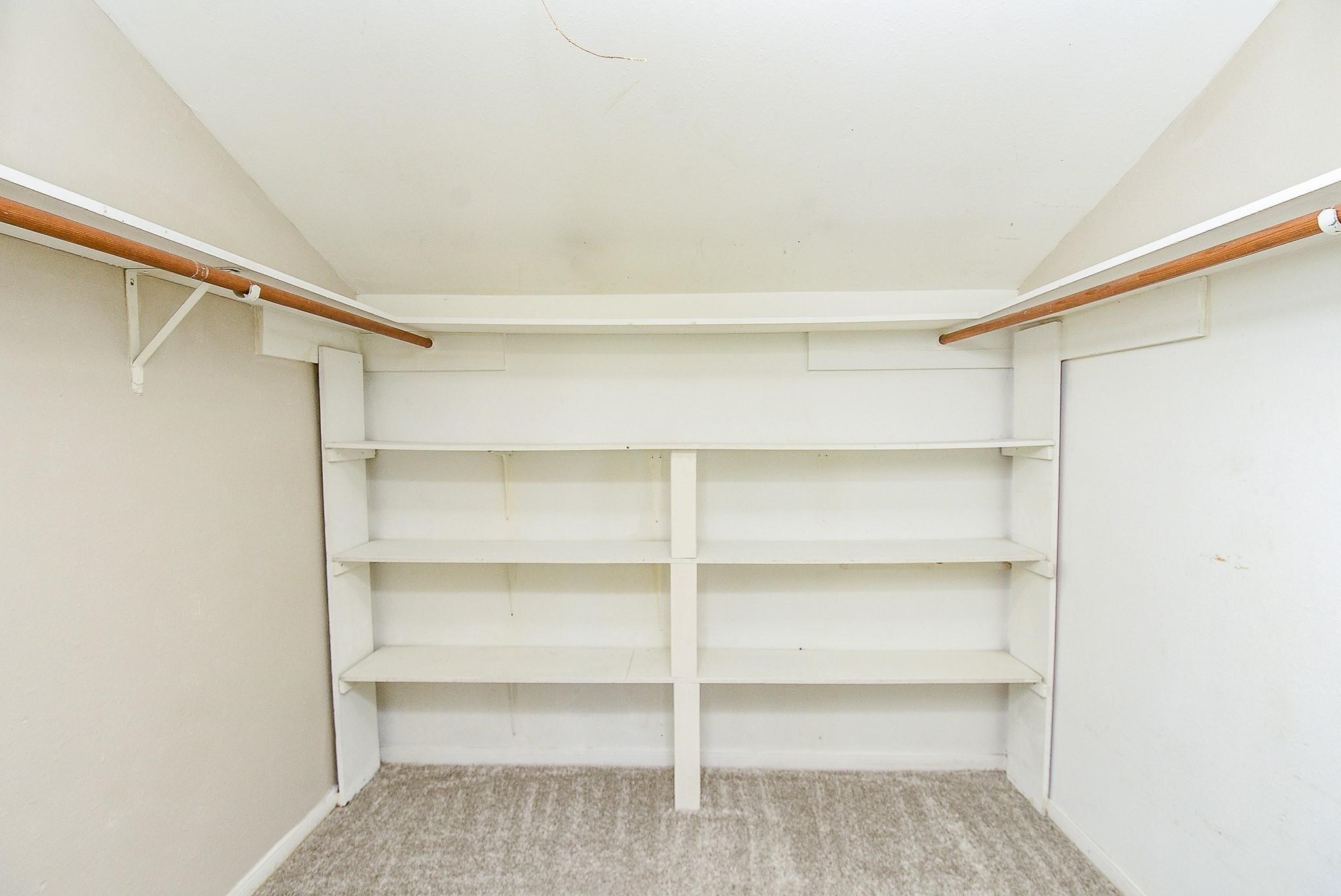 2623 Forestbrook Drive Spring, TX 77373 - Photo 22 of 27 a view of walk in closet with empty racks