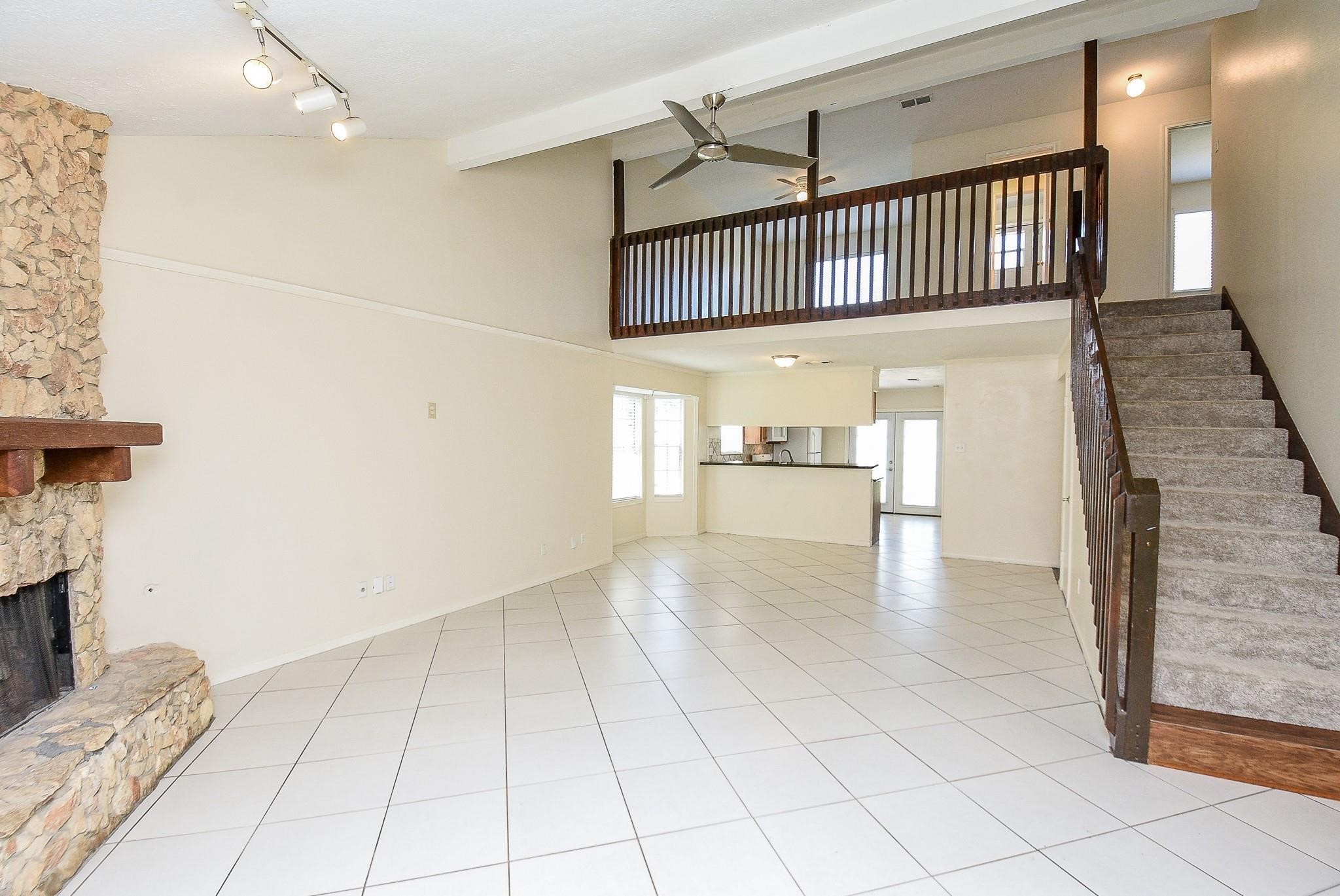 2623 Forestbrook Drive Spring, TX 77373 - Photo 4 of 27 a view of a hallway with entryway and fireplace