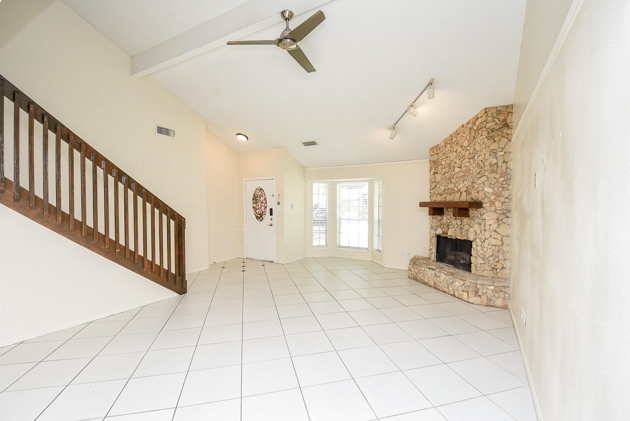 2623 Forestbrook Drive Spring, TX 77373 - Photo 6 of 27 a view of an empty room with a fireplace and a window