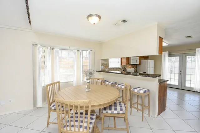 a kitchen with a stove a sink and a refrigerator