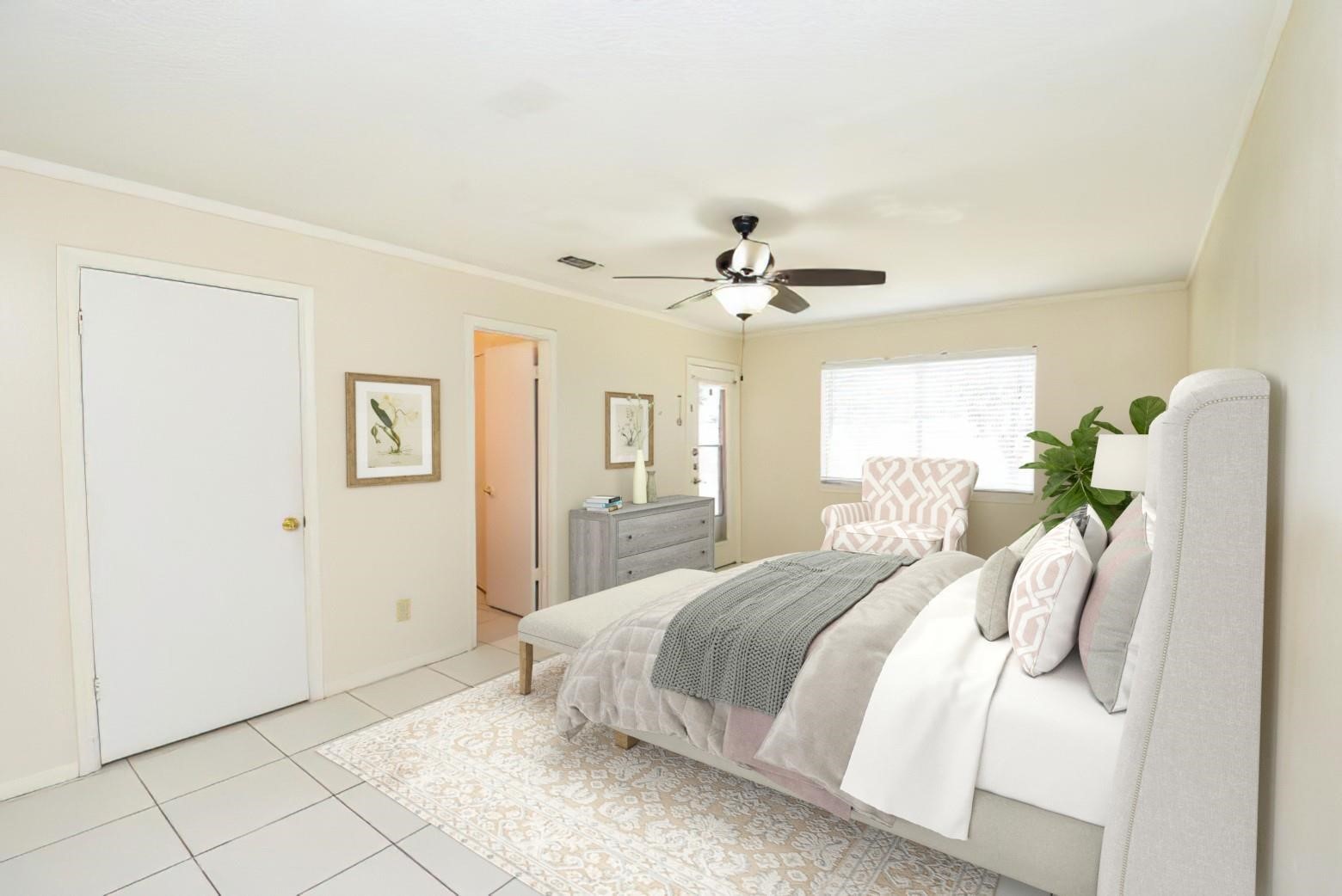2623 Forestbrook Drive Spring, TX 77373 - Photo 10 of 27 a bedroom with a bed and ceiling fan