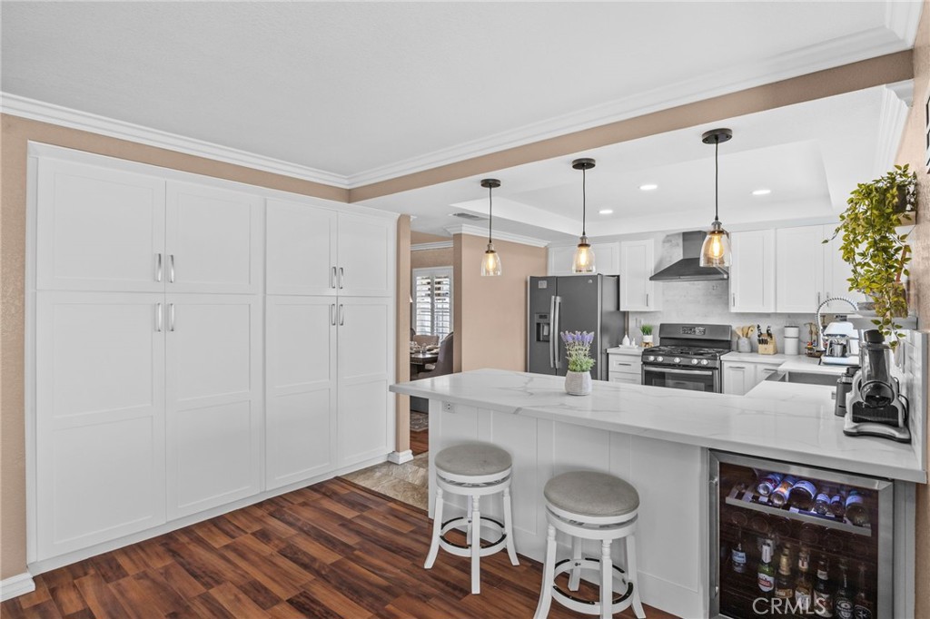 20257 Edmund Road Riverside, CA 92508 - Photo 16 of 53 a kitchen with granite countertop a stove a sink and a microwave