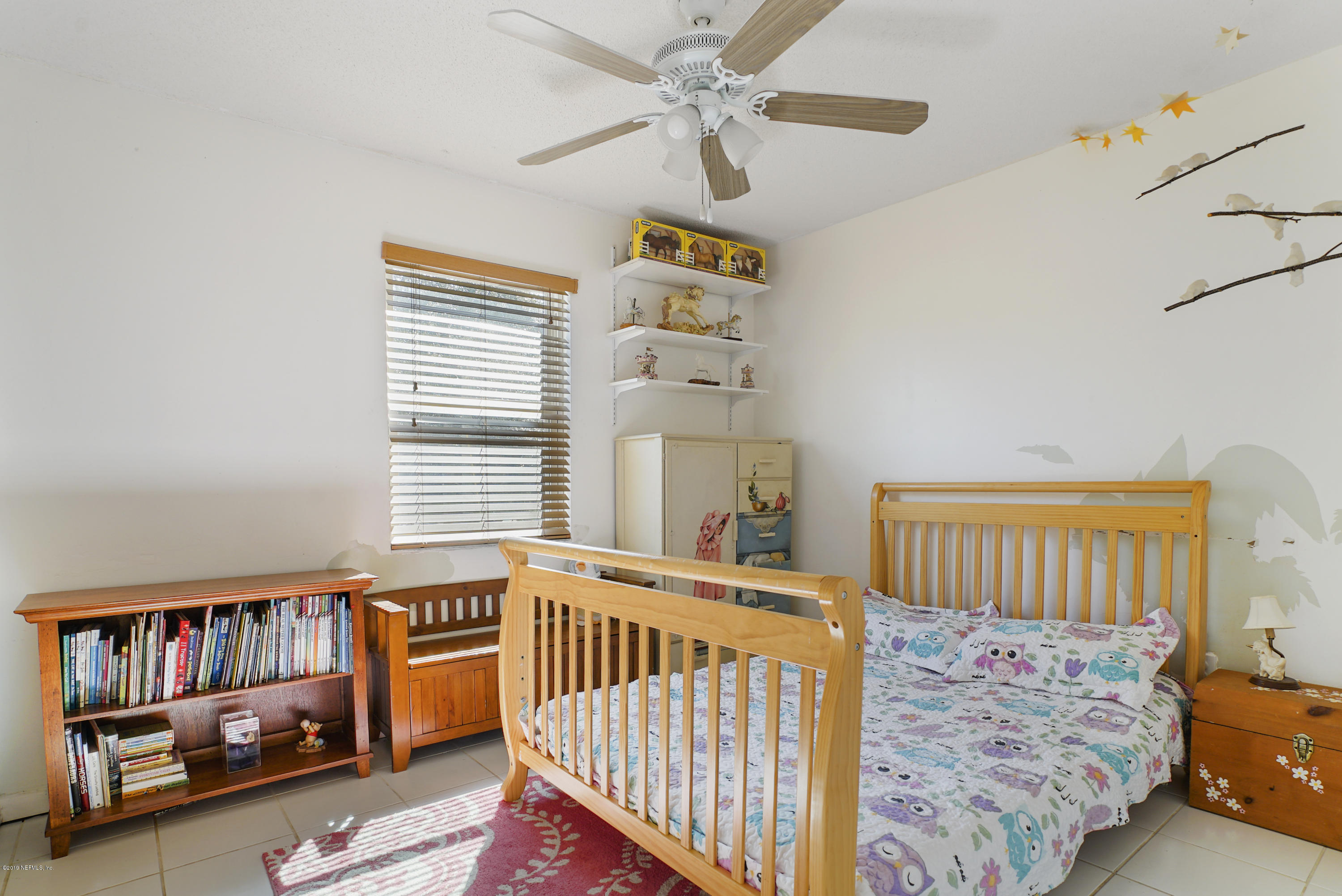 116 Harvard Road St. Augustine, FL 32086 - Photo 15 of 18 a bedroom with furniture and a window