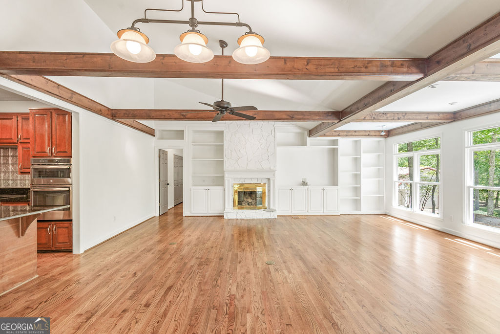 230 Haynes Road Moreland, GA 30259 - Photo 12 of 38 a view of an empty room with wooden floor and a window