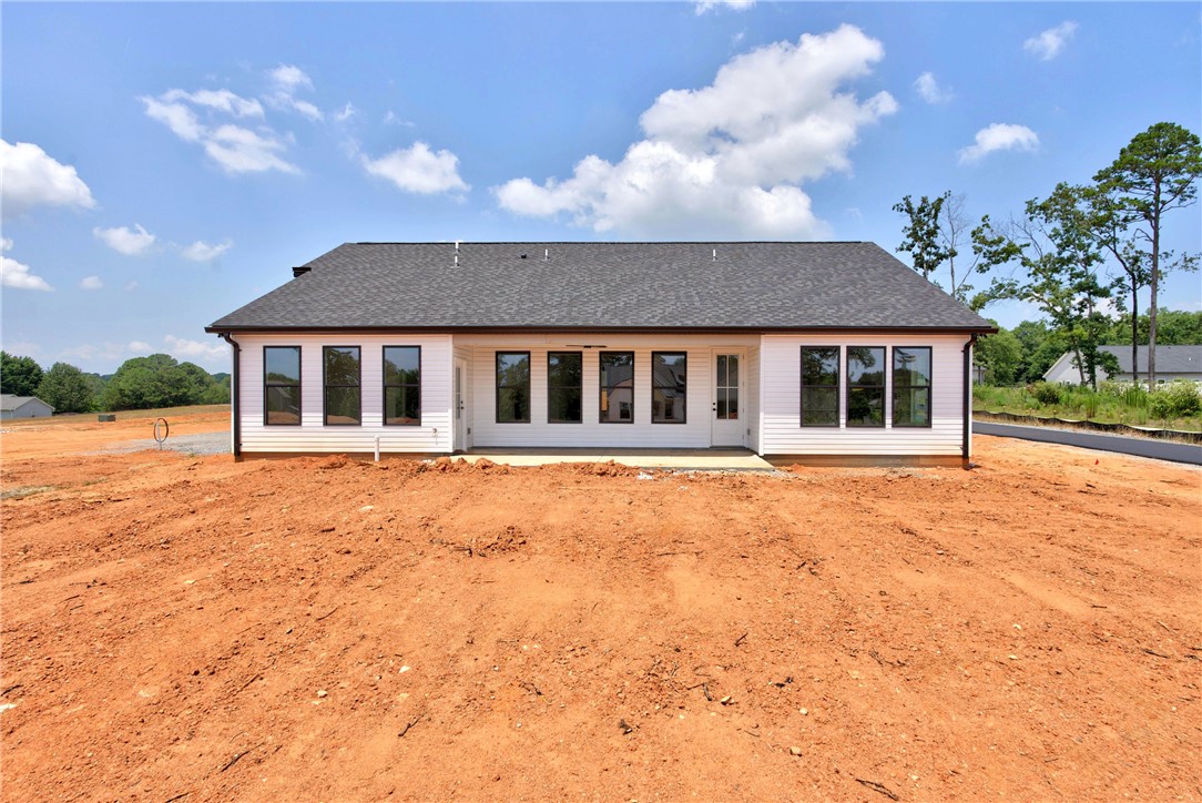 424 Blume Road Anderson, SC 29625 - Photo 28 of 30 A newly constructed residence features a crisp white exterior and dark-framed windows.