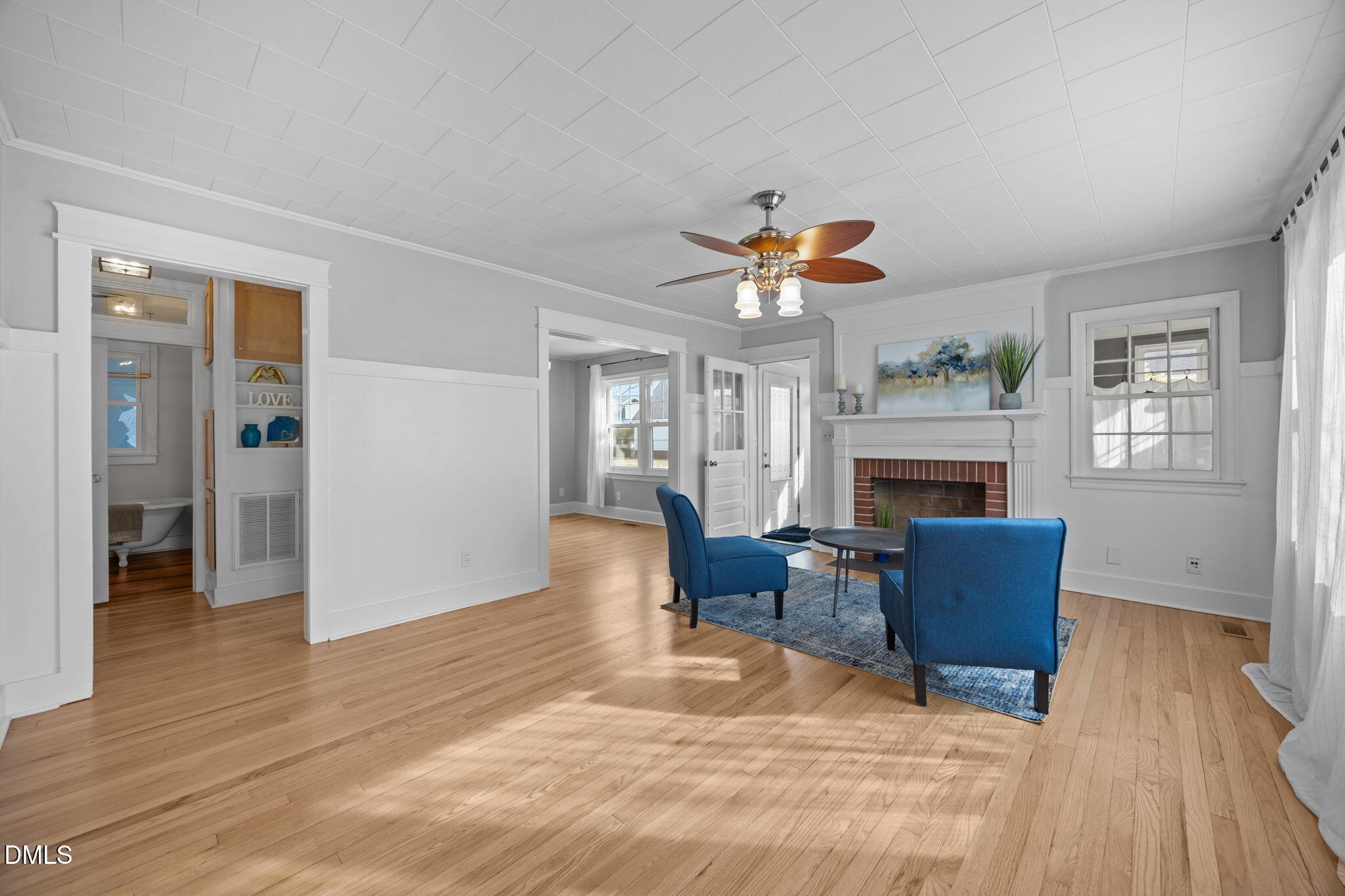 213 Guthrie Street Graham, NC 27253 - Photo 5 of 34 Featuring a fireplace and ceiling fan.