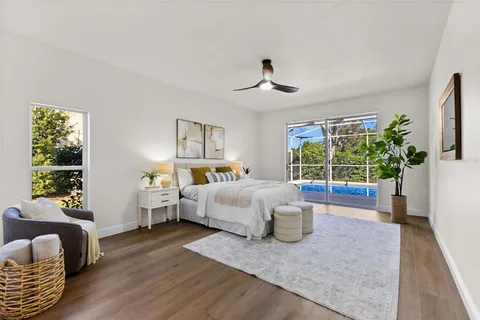 a bed room with a bed and a large window