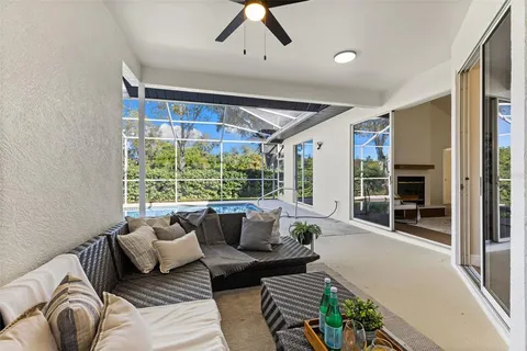 a living room with furniture and a glass door