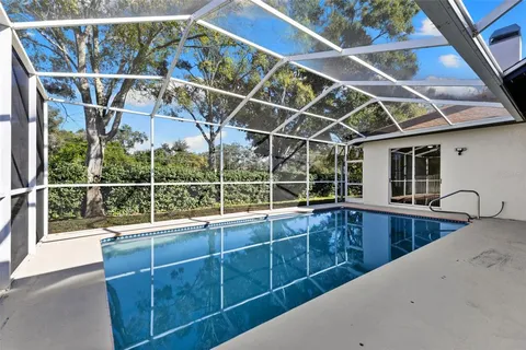 a view of a balcony with a sink and wooden floor