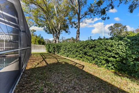 a view of a backyard with pathway