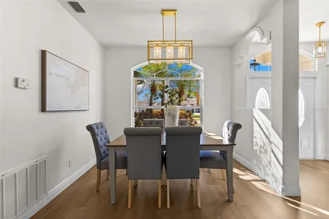 a view of a dining room with furniture window and outside view