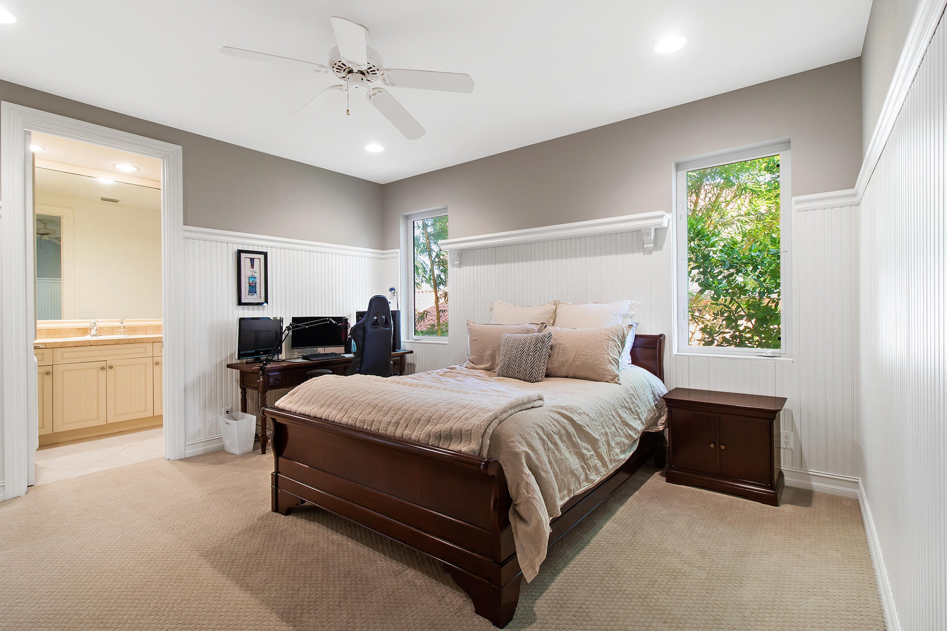 17562 Middlebrook Way Boca Raton, FL 33496 - Photo 33 of 82 a spacious bedroom with a bed and a chandelier